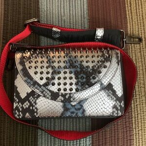 C Louboutin crossbody purse.